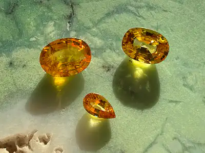 Padparadschas auf grünem Edelstein mit Schattenwurf - Edelstein Fotografie von UNIKATU